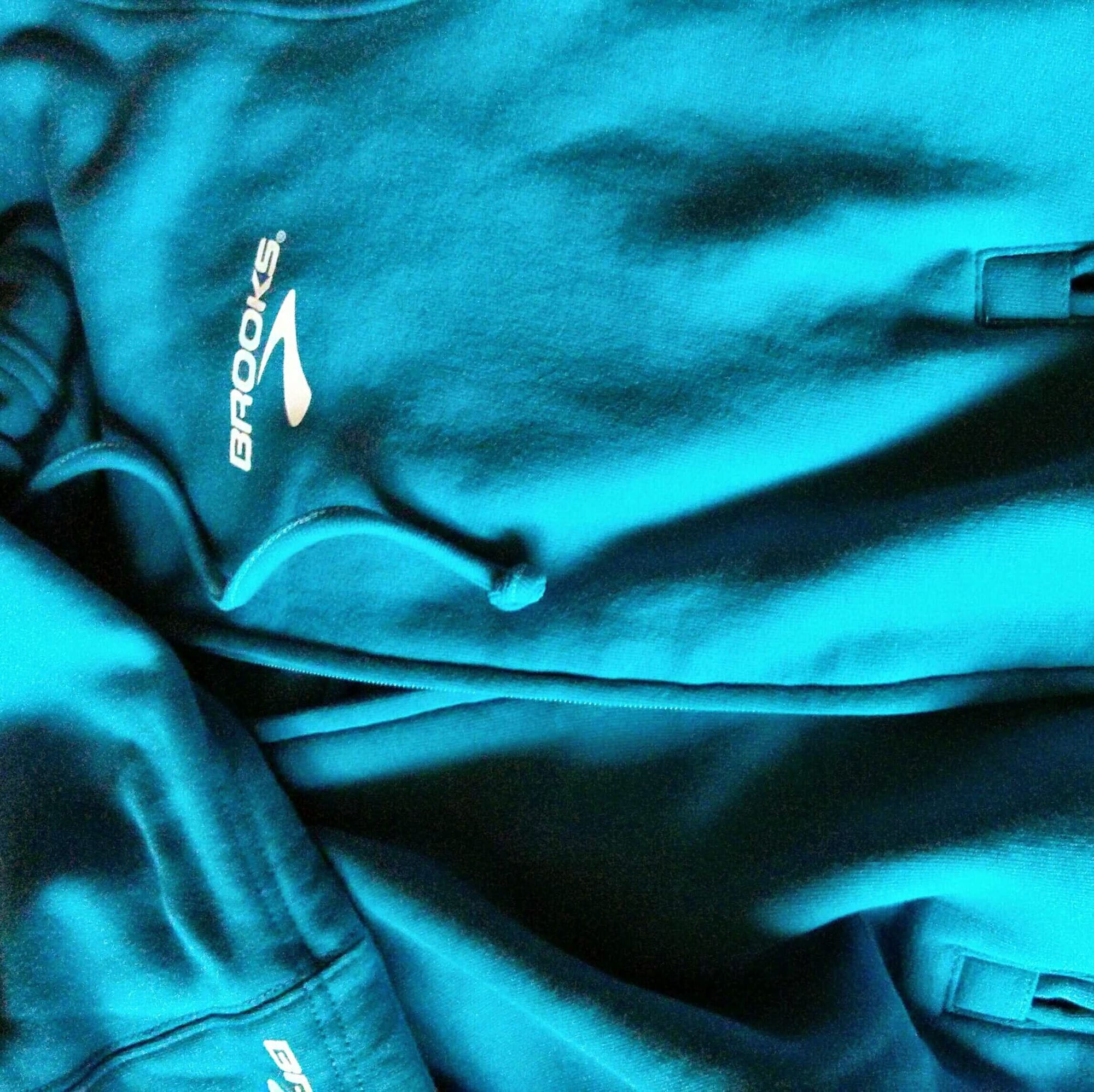 A blue Brooks running hoodie